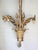Louis XVI style patinated gilt bronze chandelier Height 44 cm Width 37 cm Weight 2.4 kg Three rose-shaped tulip shades....