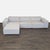 This Rove Concepts sectional features a clean, modern design in light neutral fabric. It includes a spacious chaise lounge...