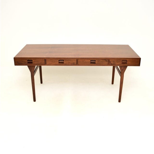 An extremely stylish and iconic Danish vintage desk by Nanna Ditzel for Soren Willadsen. Originally designed in 1955, this...