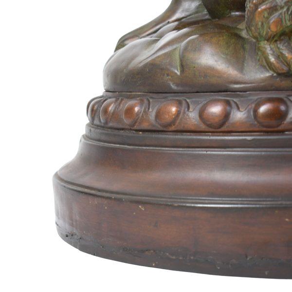 A whimsical large side table formed by three bronze-finished monkeys supporting a round glass top. The sculptural base is...