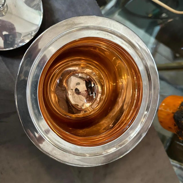 The 1980s Modernist silver-plated round ice bucket by Christofle is a quintessential example of the brand's refined and...