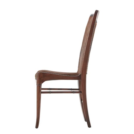 Upholstered sling back and seat with nail head decoration, on turned and splayed legs. The original Mid Century Modern....