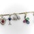 Metal 1920s Art Deco 14k Gold and Platinum Diamond and Gem Set Charm Bracelet For Sale - Image 7 of 12
