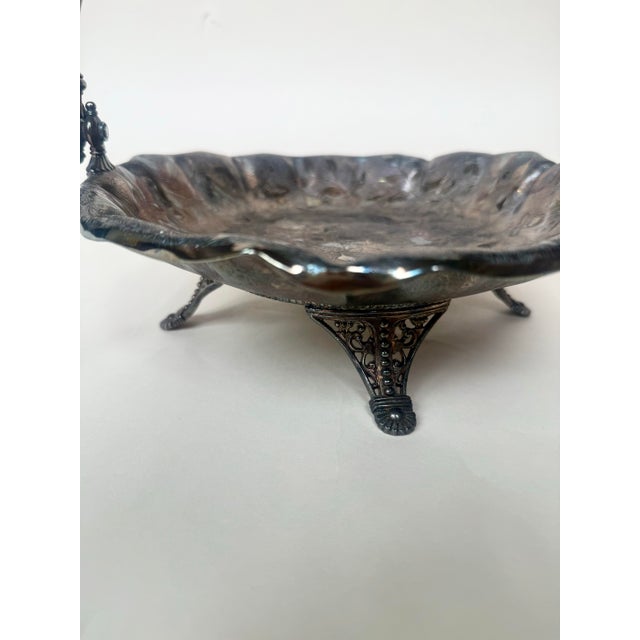 A remarkable late Victorian James W. Tufts bride’s basket in richly detailed quadruple silverplate, crafted in Boston...