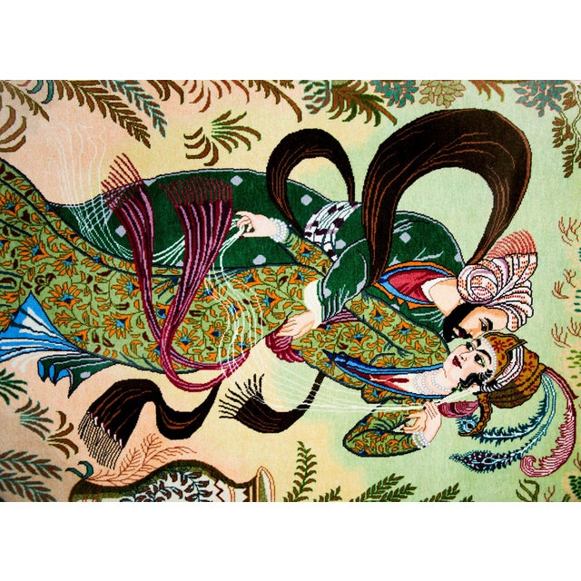 A vintage Persian Tabriz pictorial rug depicting a couple embracing with feathers, scarves, and ferns swirling around...