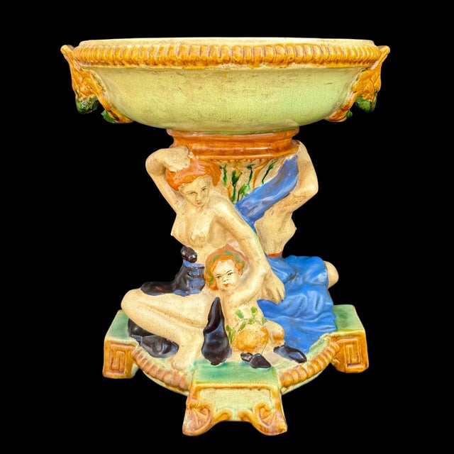 This large antique English Minton-style majolica centerpiece tazza dates to the early 20th century. The shallow flanged...