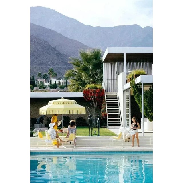 At The Linsk House 1970 by Slim Aarons Slim Aarons Limited Estate Edition Guests by the pool at Nelda Linsk’s desert house...