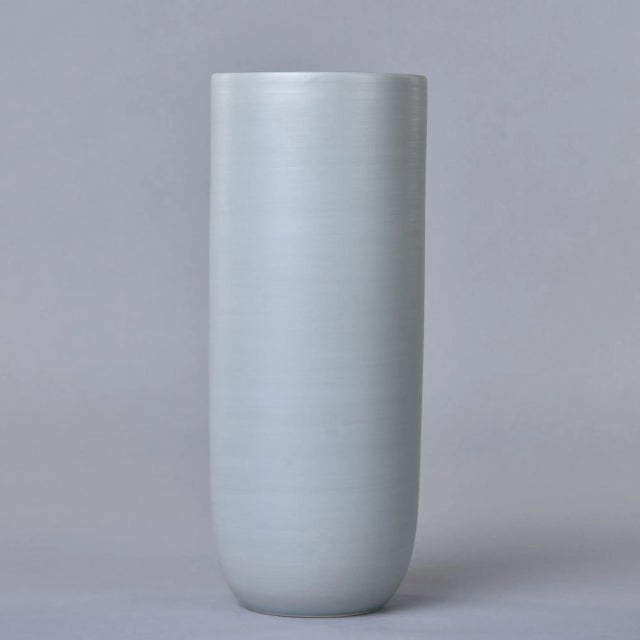 New and made in Italy by Rina Menardi, this tall Canna 1 vase stands over 12” tall. The vessel has a pale green tea...
