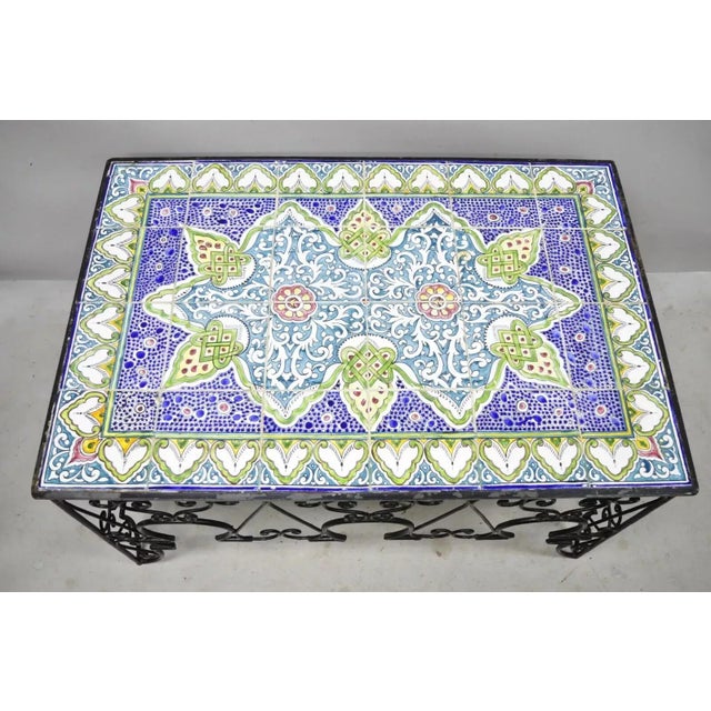 Antique Arts & Crafts Ceramic California Tile Wrought Iron Coffee Table attributed to Catalina. Item features (24) tiles,...