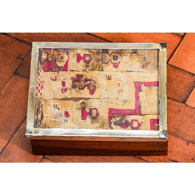 A truly exceptional collectible, this vintage Peruvian trinket box offers both mid-century charm and a remarkable...