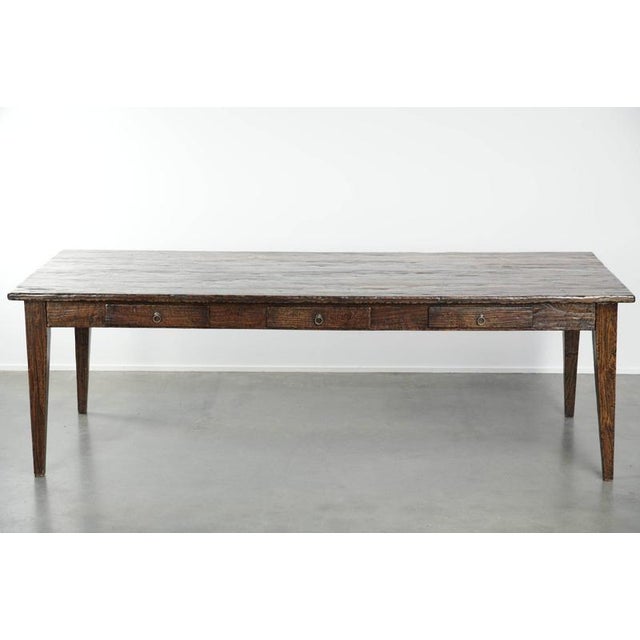 We are offering this large rustic dining table made of charming elm wood, featuring a beautiful patina and lovely details,...
