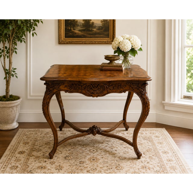 This refined French Louis XV style walnut table, likely from the 19th or early 20th century, showcases the graceful curves...
