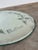 This is a lovely vintage glass mirror etched with flowers and “Mother” at the center bottom. Pie crust edge and green felt...