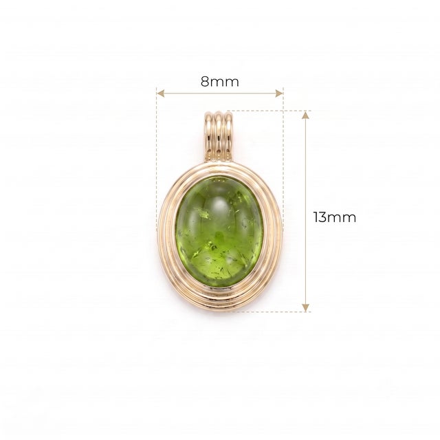 Embrace fresh, nature-inspired luxury with this vibrant Peridot cabochon pendant. Featuring a smooth, domed olive-green...
