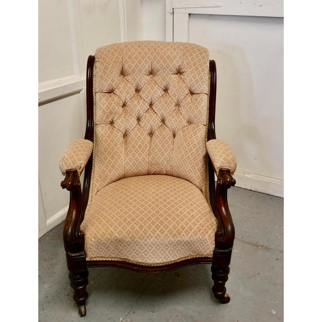 A fine quality William IV mahogany button back chair This is a superbly comfortable arm chair, it has a curved deeply...