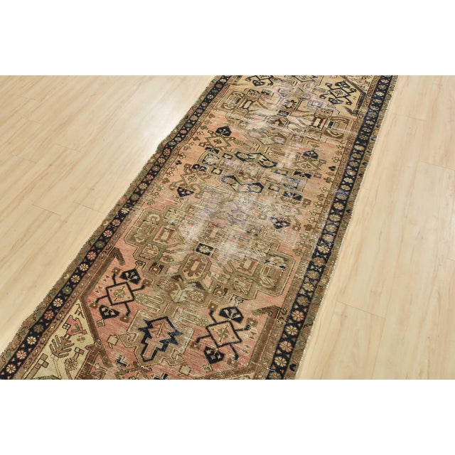An authentic semi-antique tribal Hamedan runner hand-knotted with fine wool and natural dyes. This nomadic oriental rug...