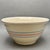 • McCoy Pottery large mixing bowl with classic pink and blue banded design. • Made in the USA, circa 1970s. • Cream glazed...