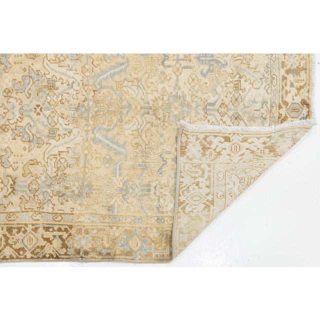 Elevate your space with this exquisite vintage hand-knotted wool rug, featuring a sophisticated palette of warm sand,...