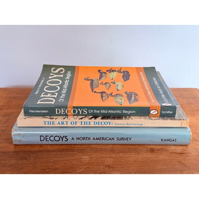 Sure to make a happy collector, this set of three vintage books is filled to the brim with artisan decoys from all over...