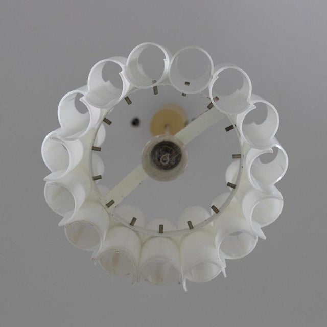 Guzzini pendant lamp in shaped white acrylic glass. Manufacturer’s label present. Replacement/revision recommended. Patina...