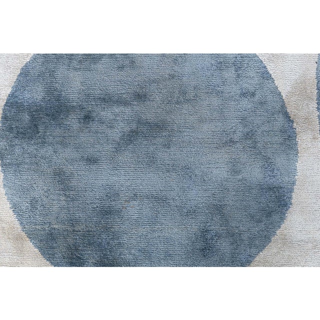 This contemporary Tibetan silk rug offers a striking visual experience, merging modern minimalism with Art Deco-inspired...