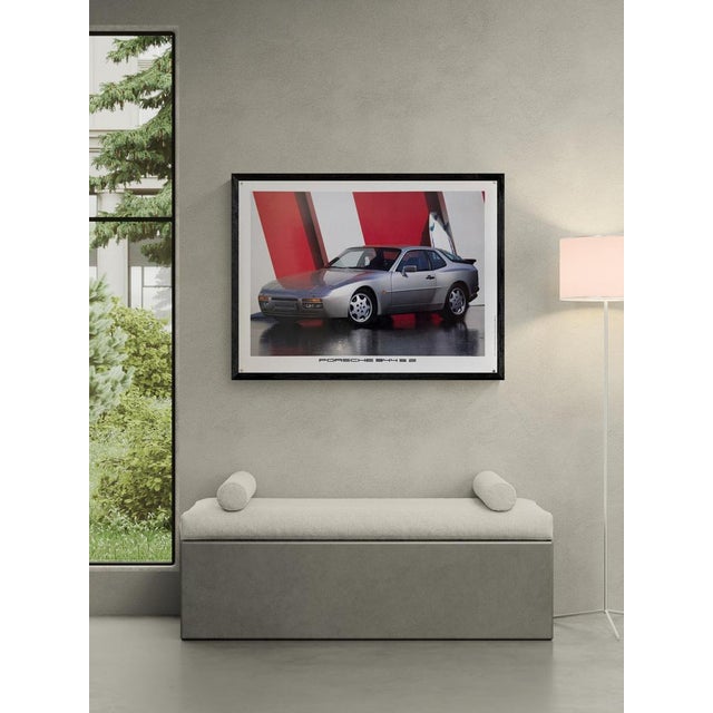 The Piece This original vintage poster features the Porsche 944 S2 in a sleek profile view. The silver bodywork contrasts...