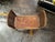 Modeled after classic European dressing stools, this elegant seat features matching raised, softly arched armrests flank-...
