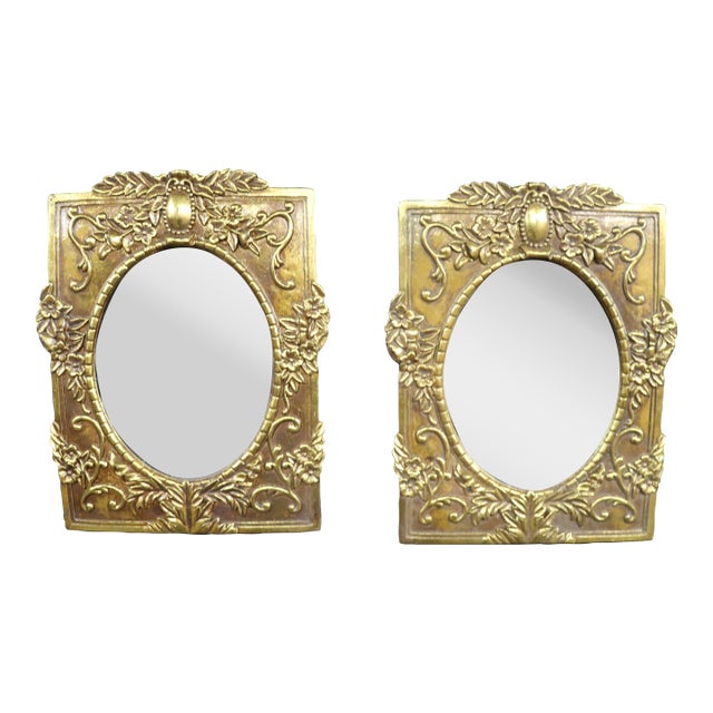 Pair of Italian Syroco Gold Wall Mirrors With Floral Relief For Sale