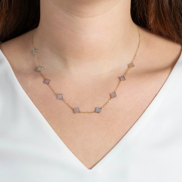 A chic way to add a pop of white and "alhambra" to your neck stack. Nine Mother of Pearl alhambras with gold chain in...