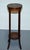 Antiques of London A fine antique hardwood two-tier plant stand dating to the early 20th century, featuring exquisite...