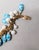Vintage Napier Book Piece Goldtone Blue & Turquoise Art Glass Charm Bracelet, 1967 For Sale - Image 10 of 15
