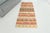 This is a vintage Turkish Oushak rug from the Mid 20th Century. The piece was hand-knotted.
