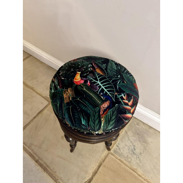 Fine quality antique Victorian mahogany revolving piano stool, having an antique Edwardian revolving piano stool with an...