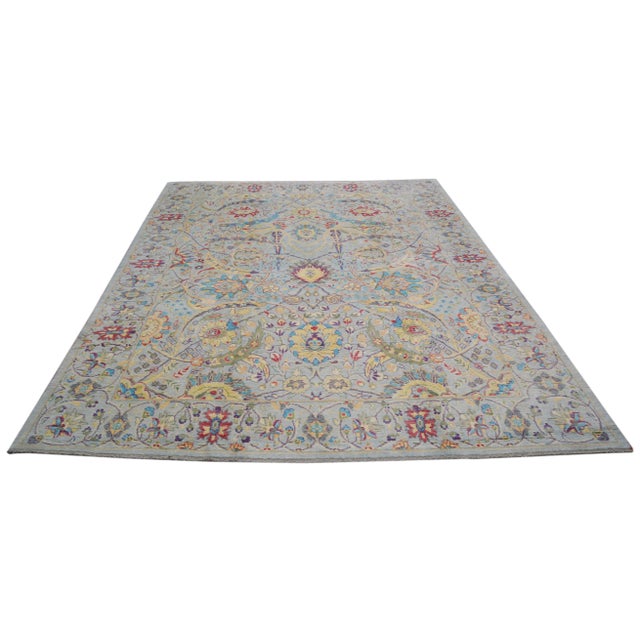 Hand-knotted with care using traditional rug making techniques, this wool rug blends timeless craftsmanship with a modern...