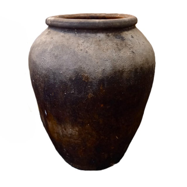 This antique jar from Spain was used to store olive oil. The lovely patina adds nice character to this large jar.