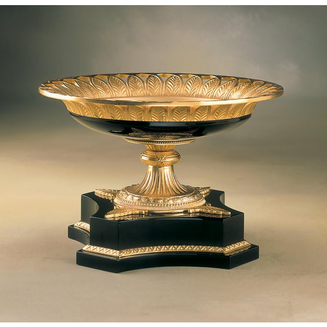Exquisite centerpiece crafted in solid bronze, elegantly plated in 24K gold. The finely detailed basin showcases intricate...