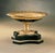 Exquisite centerpiece crafted in solid bronze, elegantly plated in 24K gold. The finely detailed basin showcases intricate...
