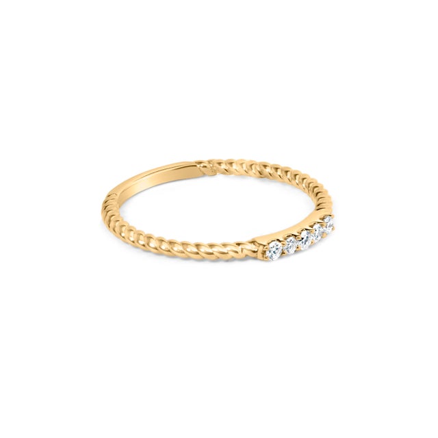 Embrace timeless elegance with this exquisite 10K yellow gold band, where five natural diamonds, summing up to 1/10 carat,...