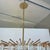 Original retail $3875, stylish Arteriors Modern Brass and Glass Nessa Round Chandelier, showroom floor sample
