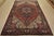 An authentic vintage traditional tribal Heriz rug hand-knotted with fine wool and natural dyes. This rug features a...