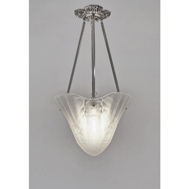 MULLER FRERES A rare French 1930 art deco chandelier in nickel plated solid brass or bronze holding a large Muller shade....