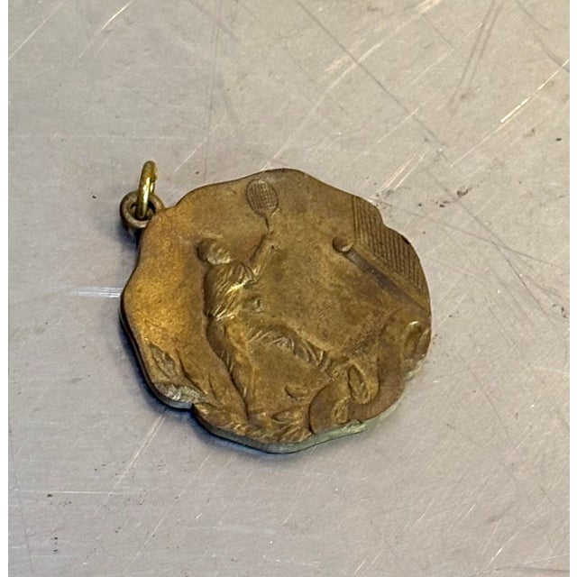 1953 "Class 8 Champs" gold tone tennis player medal/pendant. Some patina to metal throughout as shown. Otherwise excellent...