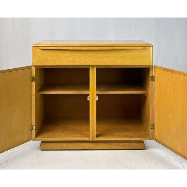Solid birch server on casters by Heywood-Wakefield. Stamped on the reverse with model number M 541, the factory finish...
