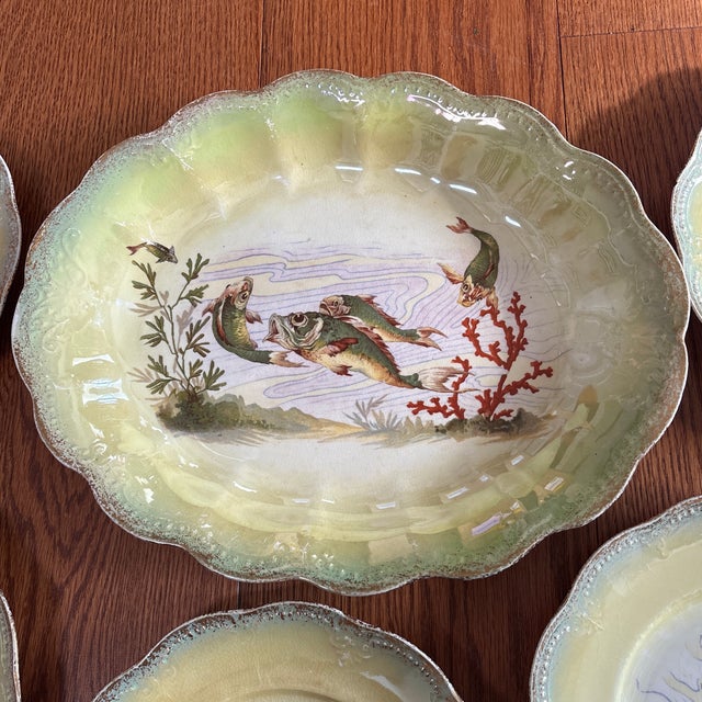 Limoges Porcelain Fish Service circa 1880-1890 with a large platter featuring five fish swimming around coral beautifully...