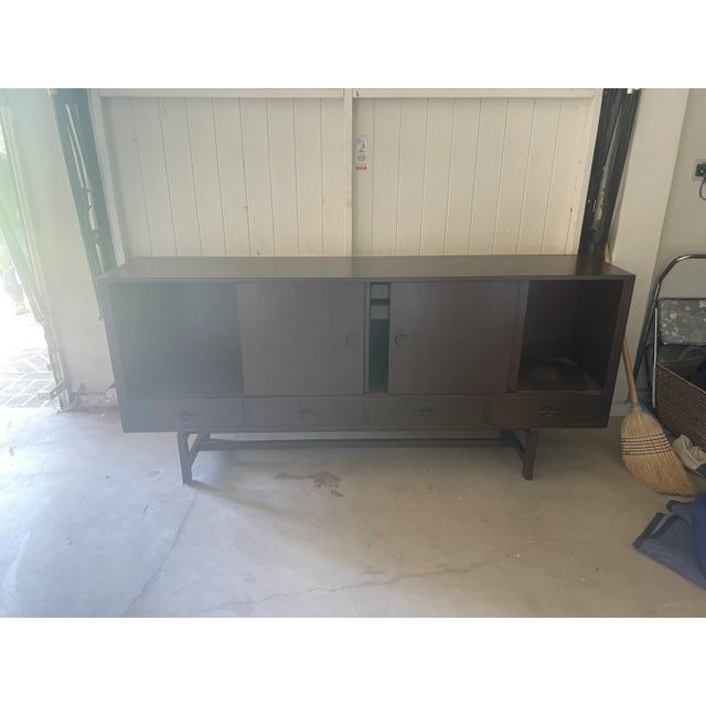Mid-Century Teak sideboard with sliding doors. 1960's with sliding doors and adjustable removable shelves.