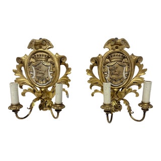 French Rococo Giltwood Armorial Two-Light Wall Sconces, 19th Century For Sale