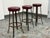 Design Plus Gallery present a Set of Three Mid 20th Century Barstools. The stools have round burgundy vinyl upholstered...