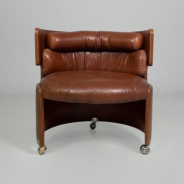 Italian mid-century modern armchair by Luigi Massoni for Poltrona Frau, 1960s Armchair fully upholstered in brown leather...