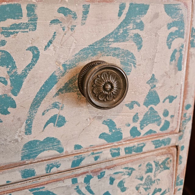 This pretty white and blue painted 3 drawer Italian style commode on tapered leg would be a beautiful accent piece or...
