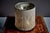 Table lamp designed by Gianfranco Frattini in 1961 and produced by Arteluce. Cylindrical structure covered with a dense...